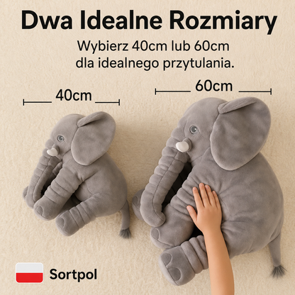 Poduszka słoń w kolorze różowym na łóżku dziecięcym